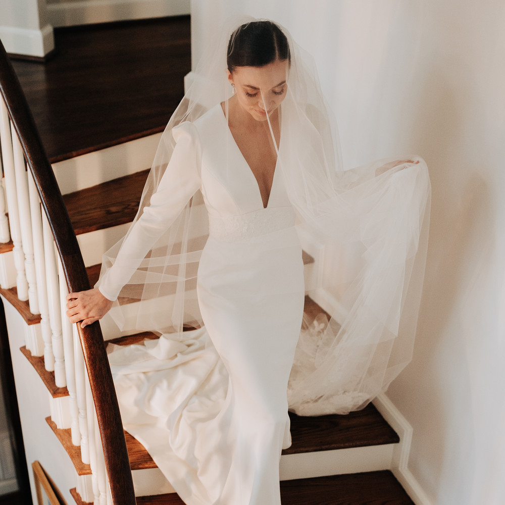 A bride on the Manor Home stairway